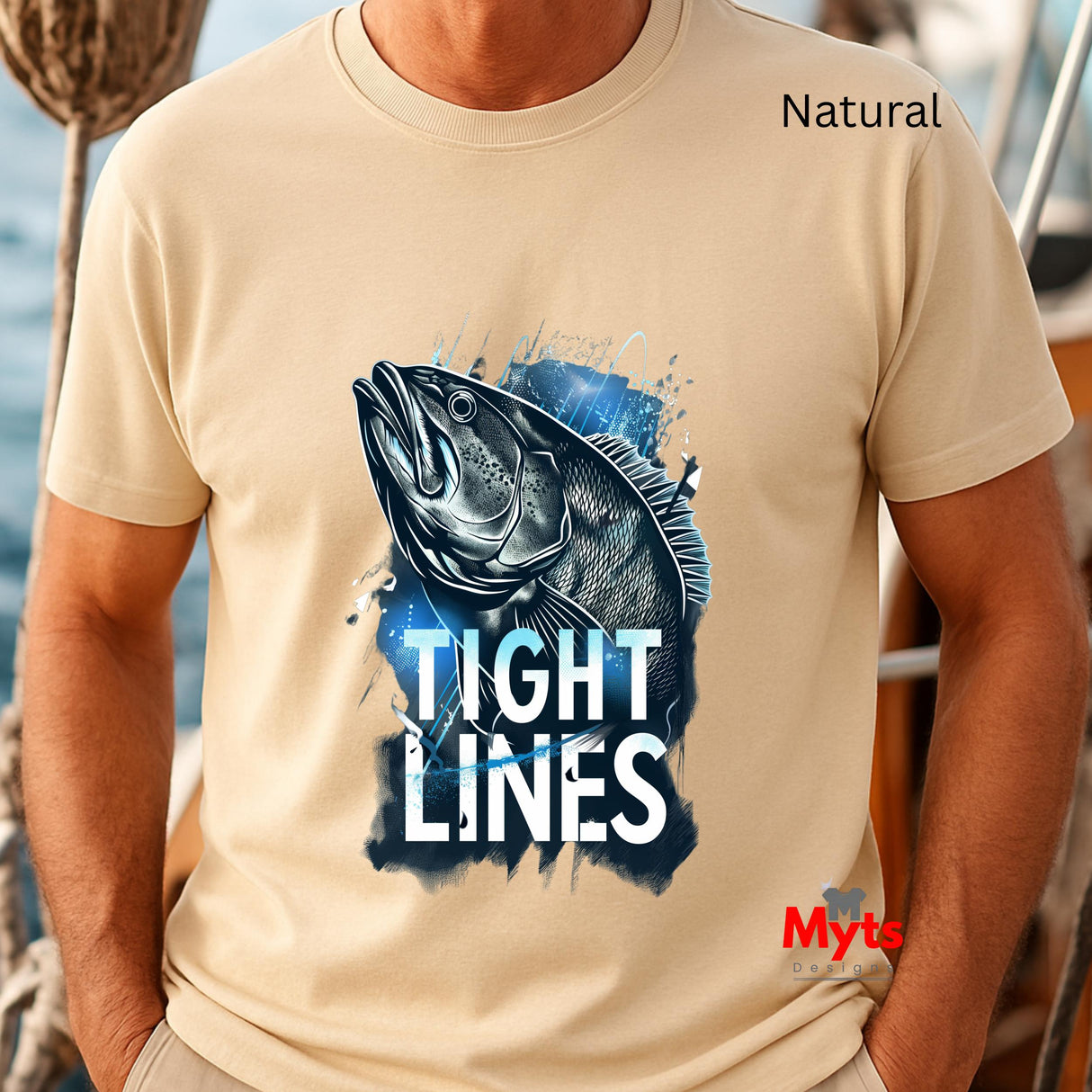 Natural t-shirt with a fish graphic and 'Tight Lines' text, worn by a person on a boat.