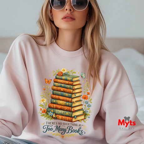 Woman wearing a pink sweatshirt with a book-themed design and 'Myts' branding.