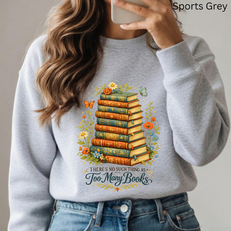 Person wearing a gray sweatshirt with a book-themed design and text.