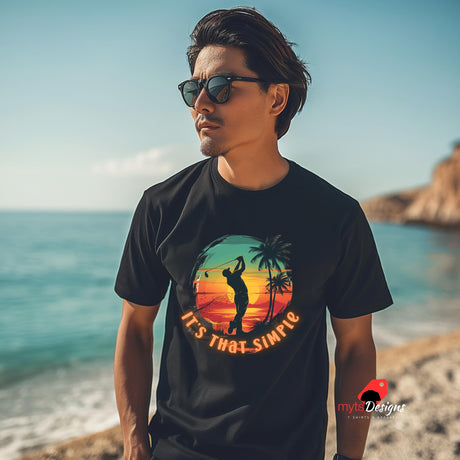 Man wearing a black t-shirt with a graphic design on a beach
