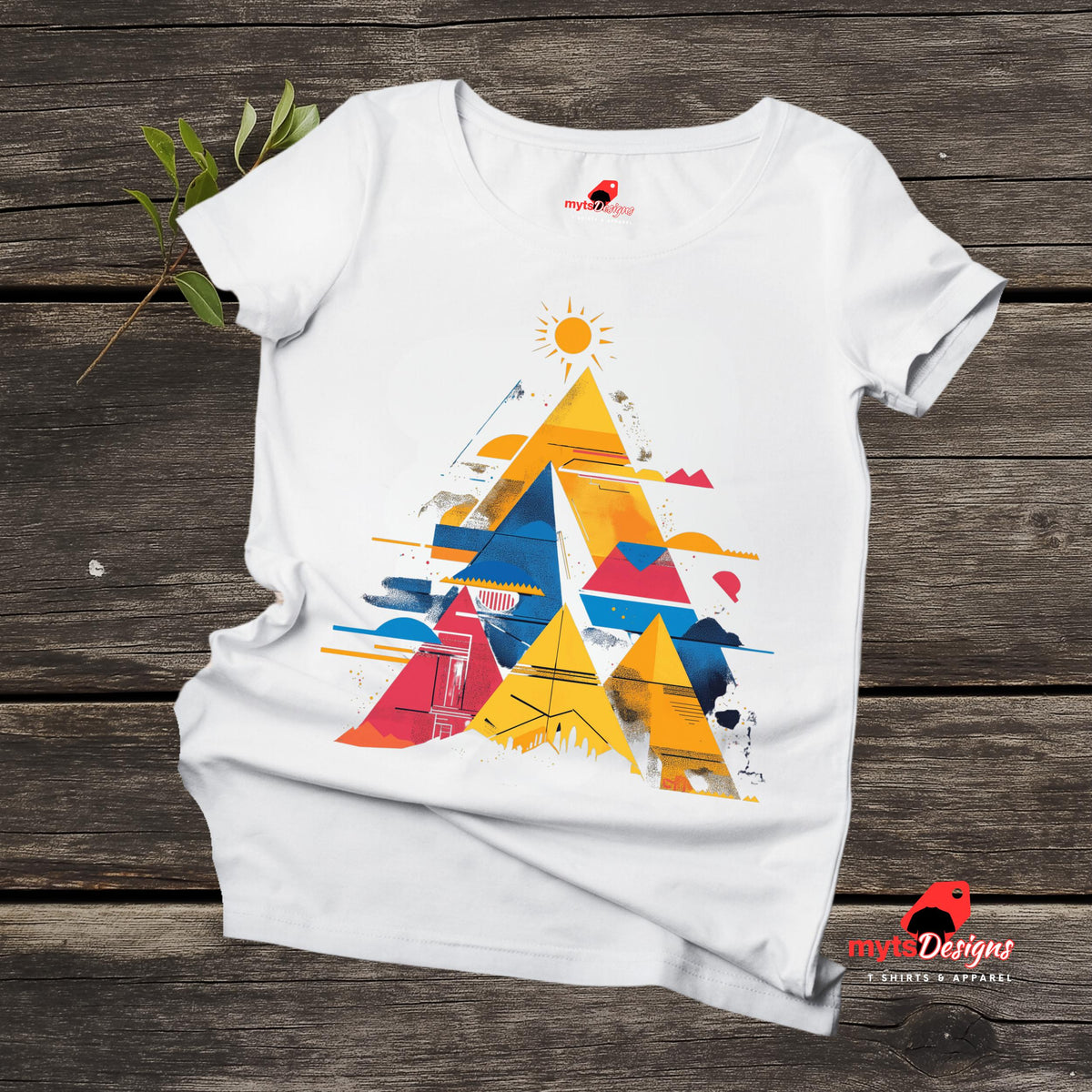 Flat lay view of vivid geometric pyramid T-shirt featuring multicolor radiant design on white cotton tee