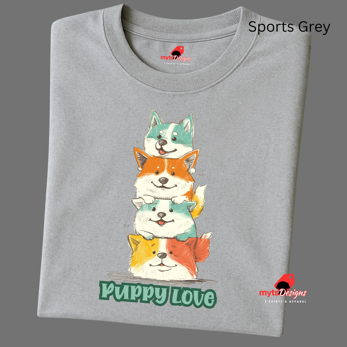 A folded sports grey T-shirt featuring a colorful graphic of four stacked cartoon puppies in teal, orange, cream, and yellow shades with the words “Puppy Love” in playful green text below

