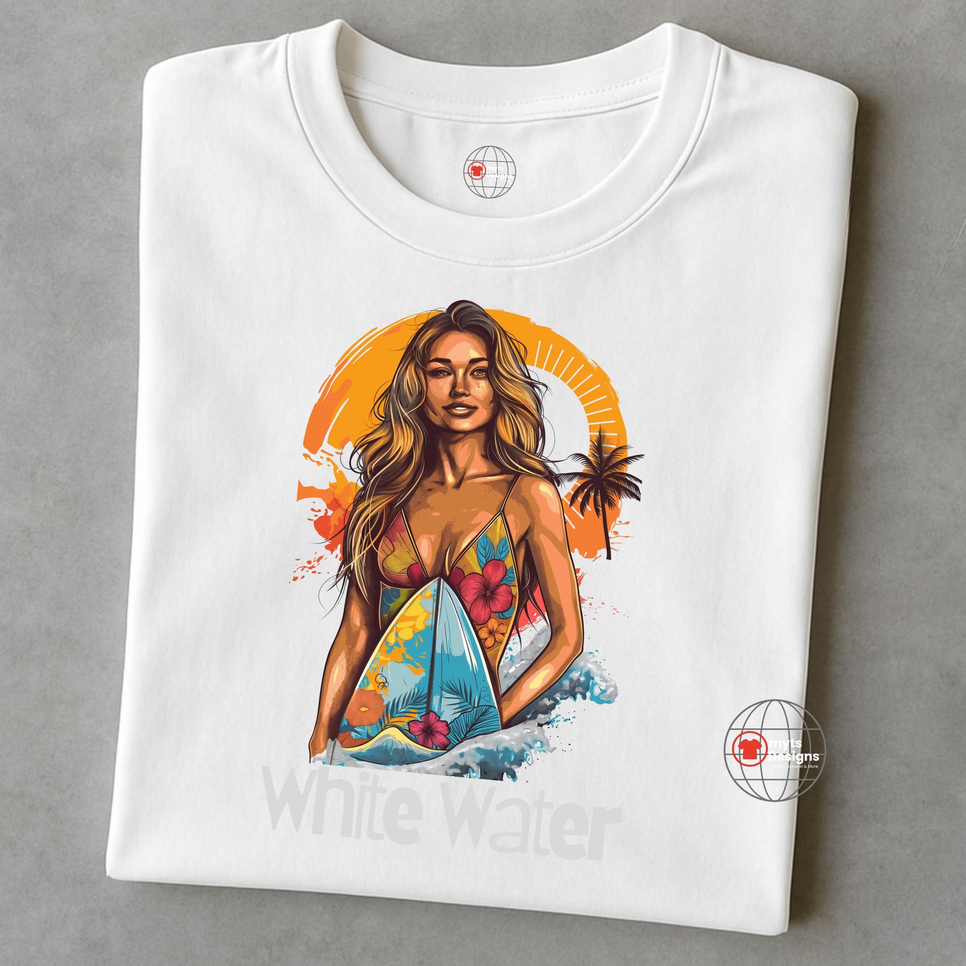 A folded WhiteT-shirt featuring a vibrant illustration of a confident woman in a floral bikini holding a surfboard with ocean waves and an orange tropical sunset in the background. Below the graphic is the text “White Water.”