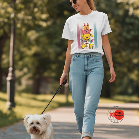 Woman walking a dog in a park wearing a graphic t-shirt
