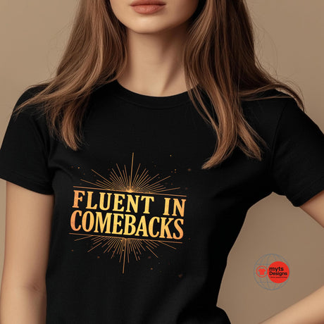 Person wearing a black t-shirt with 'Fluent in Comebacks' in gold text on a beige background