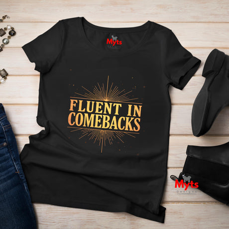 Fluent in Comebacks graphic T-shirt with gold typography statement design on black casual unisex tee