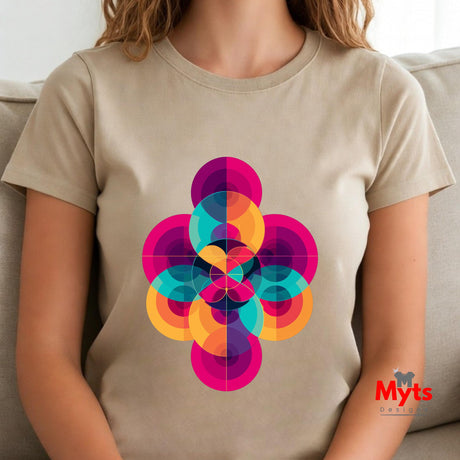 Person wearing a Natural (Beige) t-shirt with a colorful geometric design, sitting on a couch.