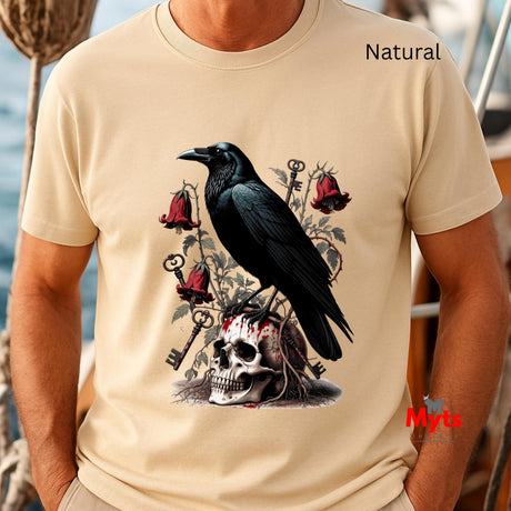 A man wearing a Natural t-shirt with a gothic graphic print of a black raven perched on a skull with red roses and keys. The text 'Natural' is printed on the upper right chest, and a red 'Myts' logo is visible in the lower right corner.