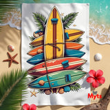 Colorful surfboard design on a towel with beach elements like shells and flowers.