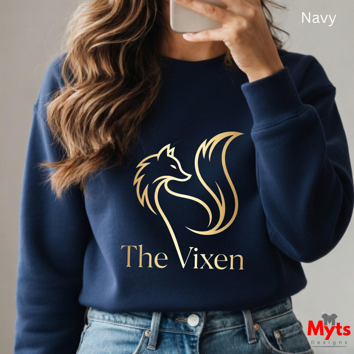 Navy sweatshirt with 'The Vixen' logo worn by a person, with 'Myts' branding visible.