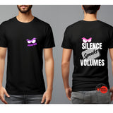 Black t-shirt with graphic design on front and text on back, worn by a person against a gray background.