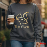 Person wearing a dark Heather sweatshirt with 'The Vixen' logo, holding a coffee cup.