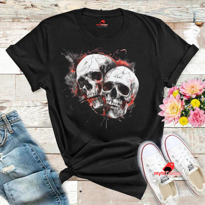 Black t-shirt with skull design on a wooden surface with jeans and shoes.