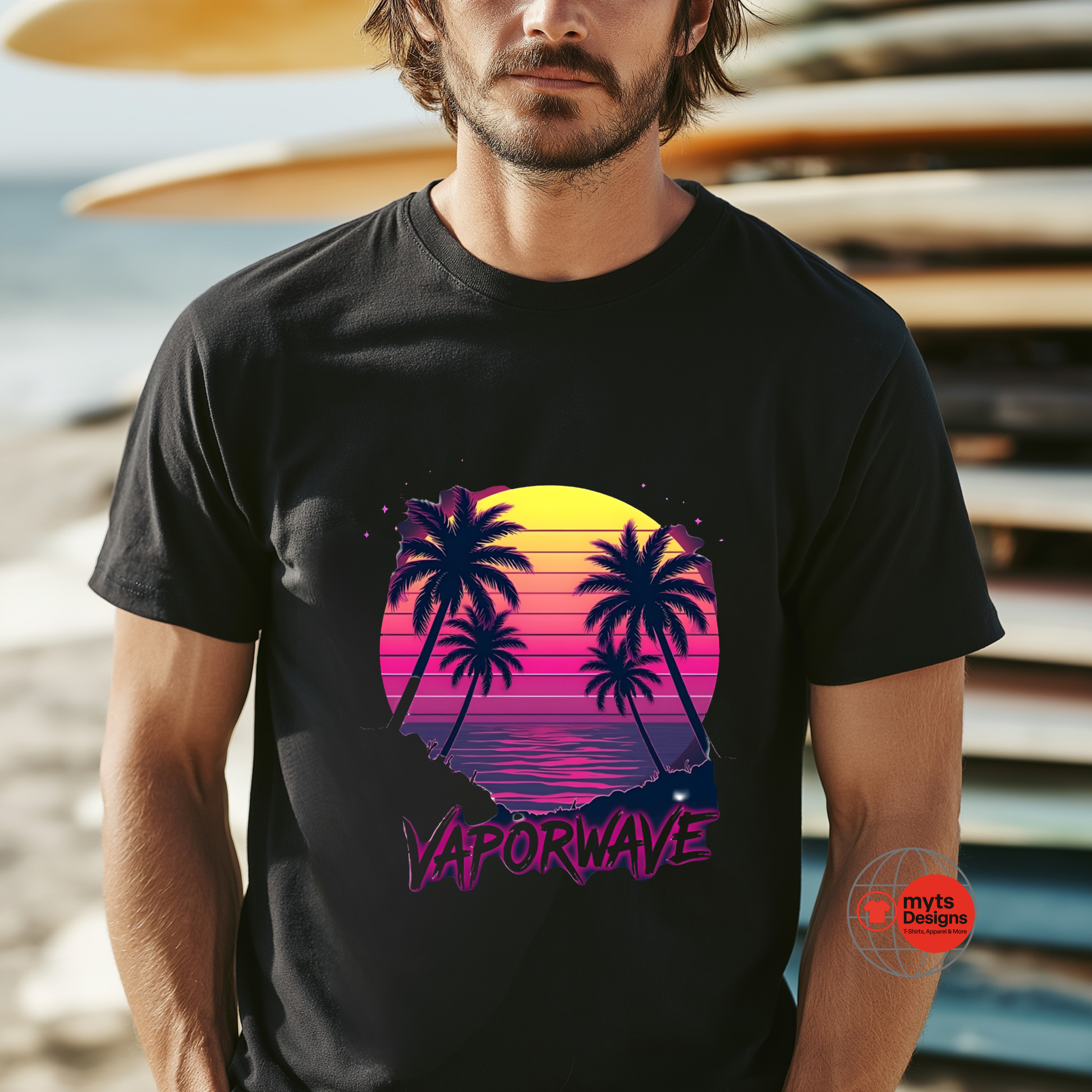 Man wearing a black t-shirt with a vaporwave design featuring palm trees and a sunset.