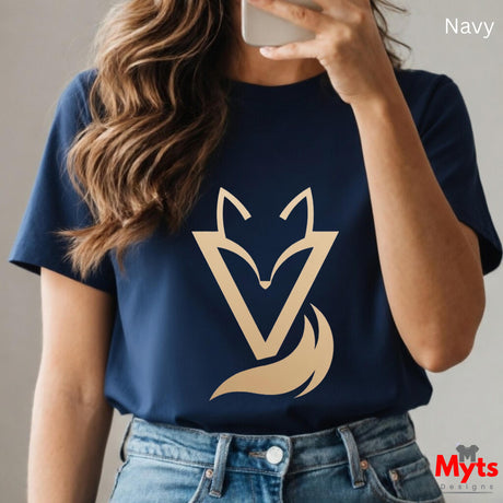Woman wearing a Navy Vixen minimalist fox graphic T-shirt featuring a modern gold-toned geometric fox symbol with a flowing tail design.