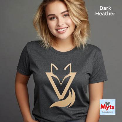 Woman wearing a Dark Heather Vixen minimalist fox graphic T-shirt featuring a modern gold-toned geometric fox symbol with a flowing tail design.