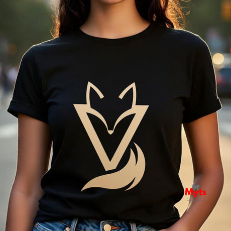 Woman wearing a black Vixen minimalist fox graphic T-shirt featuring a modern gold-toned geometric fox symbol with a flowing tail design.