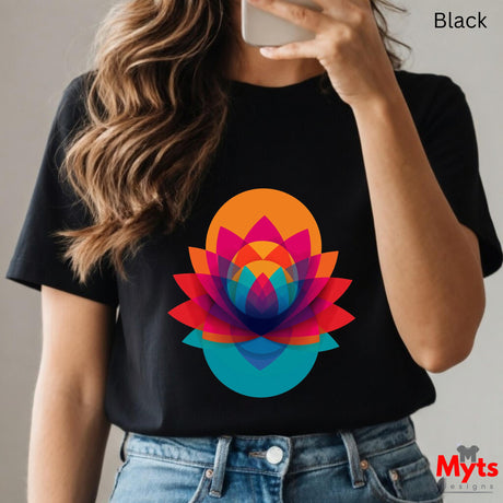 Person wearing a black t-shirt with a colorful lotus design, holding a phone.