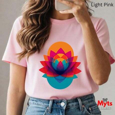 Person wearing a pink t-shirt with a colorful geometric flower design, holding a phone.
