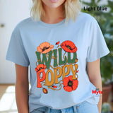 A woman wearing a light blue graphic t-shirt with a colorful 'WILD POPPY' design in orange, red, and green, with a 'Light Blue' text overlay in the top right.