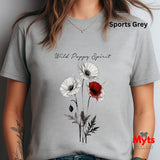 A woman wearing a Sports Grey crewneck T-shirt with a poppy graphic print. The graphic features three white poppies and one red poppy with black stems and leaves, and the text 'Wild Poppy Spirit' is printed above.ts