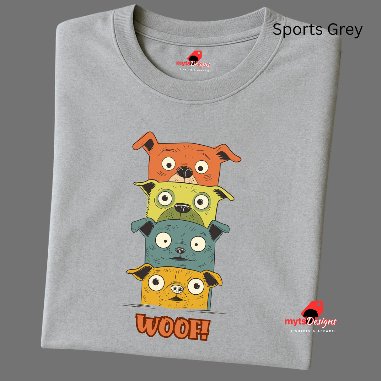 A folded sports grey T-shirt featuring a quirky graphic of four stacked cartoon dogs in orange, yellow, teal, and golden tones with playful “WOOF!” text below the design.