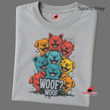 A folded sports grey T-shirt featuring a vibrant graphic of cartoon puppies stacked in red, orange, blue, and yellow hues, with the playful text “WOOF? WOOF” below the design.