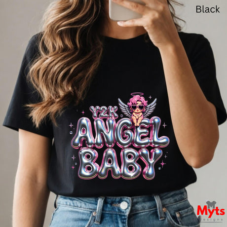 Person wearing a black t-shirt with 'Y2K Angel Baby' design, holding a phone.