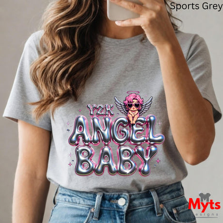 Person wearing a gray t-shirt with 'Y2K ANGEL BABY' design and taking a selfie.