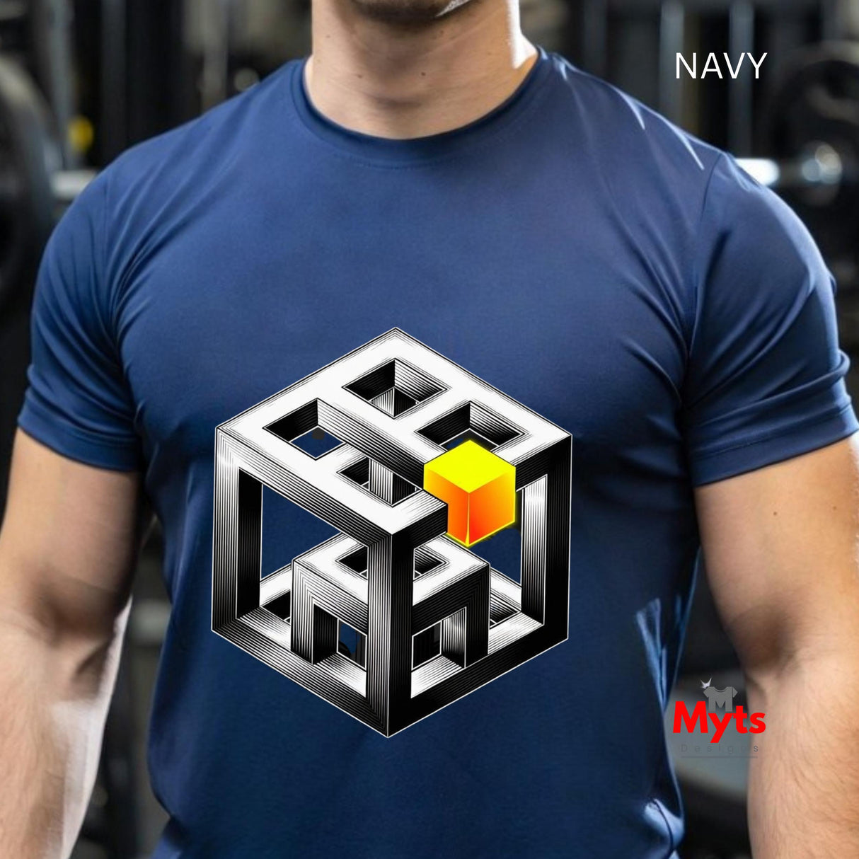 Blue t-shirt with a geometric design featuring a yellow cube, worn by a person.