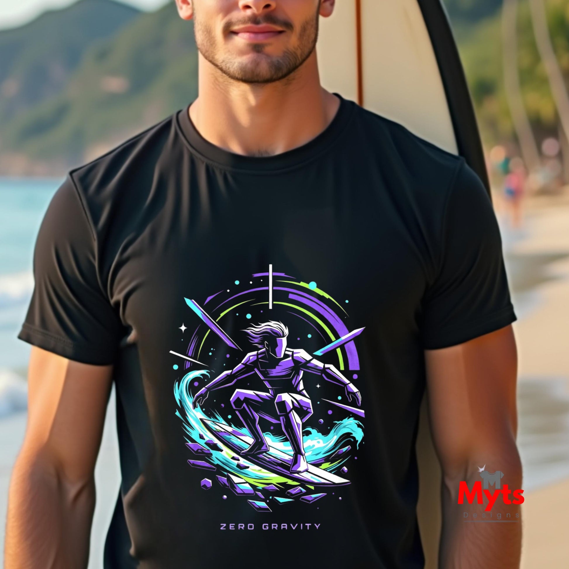 Man wearing a black t-shirt with a colorful graphic design on a beach.