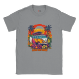 A grey T-shirt with a vibrant graphic of a retro yellow Kombi van, surfboards, tropical flowers, palm trees, and a bold orange sunset.