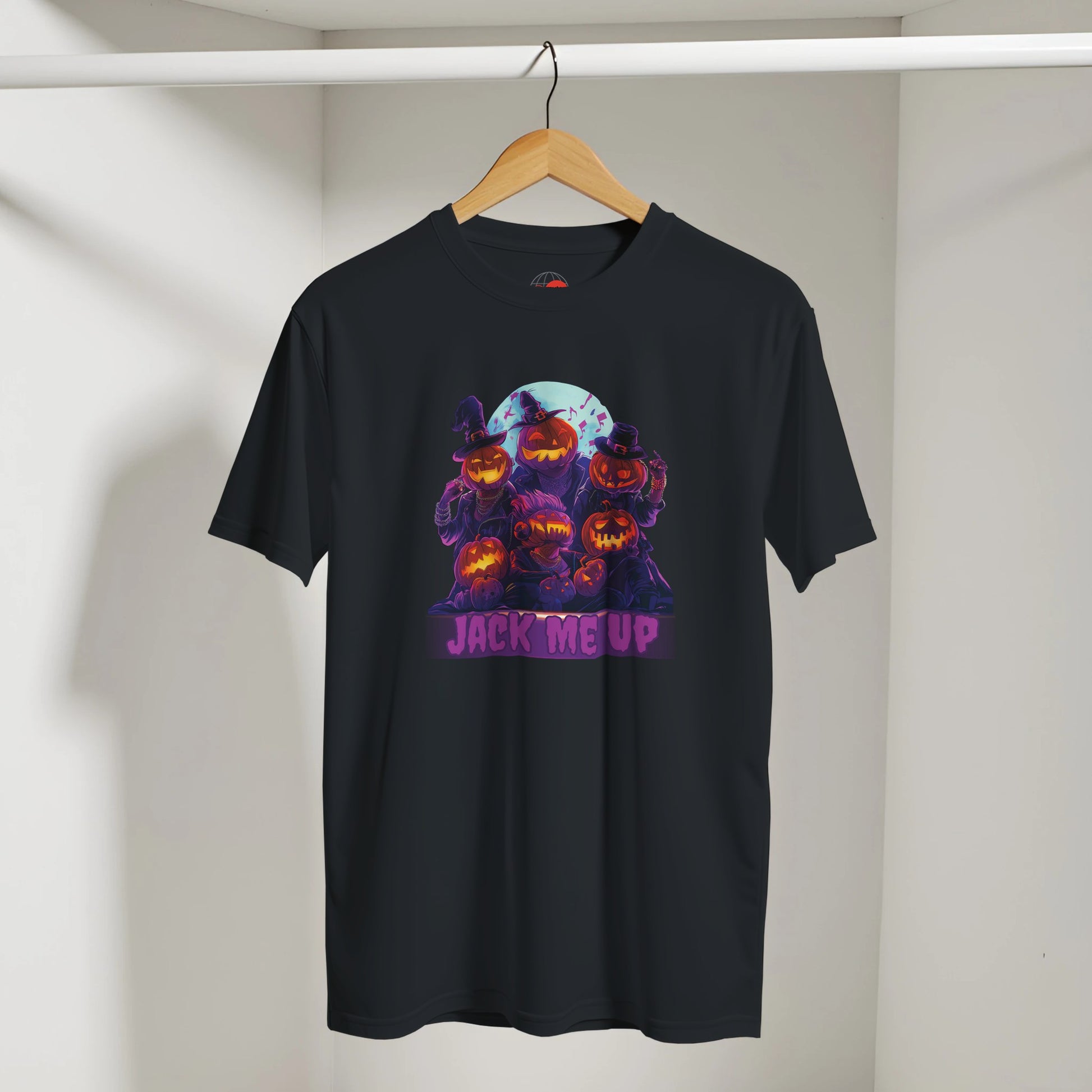 Black t-shirt with Halloween-themed design featuring pumpkins and 'Jack me up' text on a hanger against a white wall.