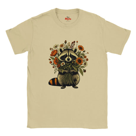 A Sand crewneck T-shirt featuring a vintage-style graphic of a raccoon holding a bouquet of orange and yellow flowers, displayed on a clean white background.