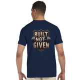 Man wearing a navy blue t-shirt with 'Built Not Given' text and barbell graphic on the back.