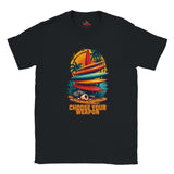 Black t-shirt with a colorful graphic design featuring surfboards and palm trees, and the text 'Choose Your Weapon' on a white background.