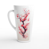 A tall white ceramic latte mug featuring a printed watercolor design of a cherry blossom tree branch with pink and red flowers on a light beige background.