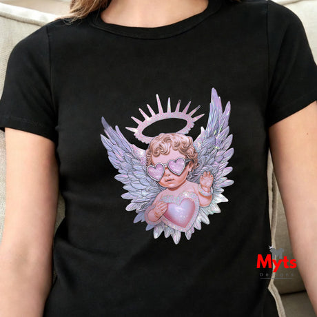 Black t-shirt with an angel graphic design featuring wings and a halo, held by a heart, worn by a person.