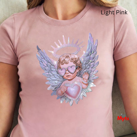 Light pink t-shirt with an angel design featuring wings and a heart, worn by a person.