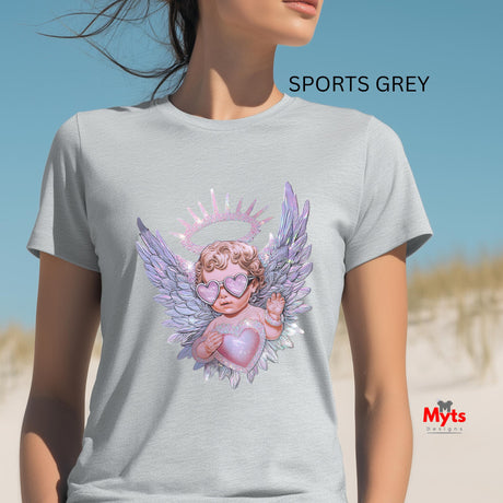 Person wearing a gray t-shirt with an angel design on a beach, featuring the brand 'Myts'.