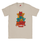 A flat lay neutral T-shirt featuring a vibrant graphic of cartoon puppies stacked in red, orange, blue, and yellow hues, with the playful text “WOOF!” below the design.
