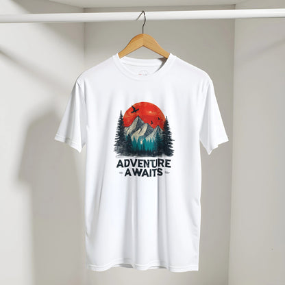 White t-shirt with 'Adventure Awaits' graphic on a hanger against a plain background