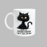 A white ceramic mug with a printed black cat design, text, and a barcode.