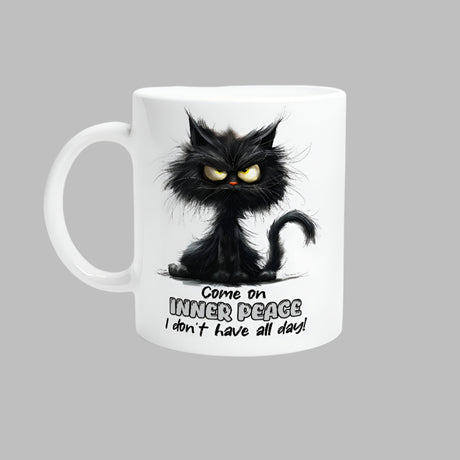 A white ceramic mug with a printed black cat design, text, and a barcode.