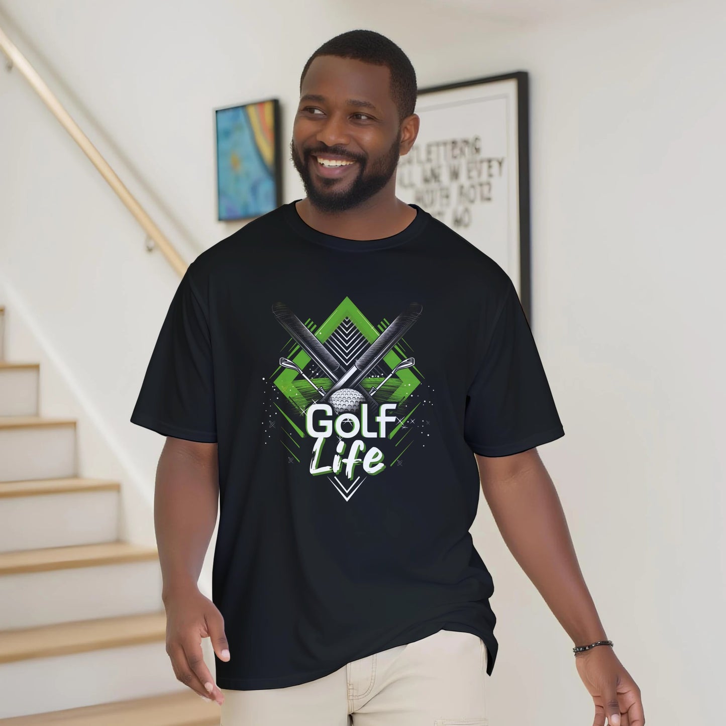Man wearing a black t-shirt with 'Golf Life' design indoors.