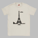 Front view of a white soft casual tee featuring a whimsical graphic of the Eiffel Tower with a retro‑style spaceship orbiting it, printed on ultra‑soft Gildan 64000 cotton.