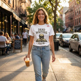 Woman walking on a city street wearing a 'Dead Writers Club' t-shirt.