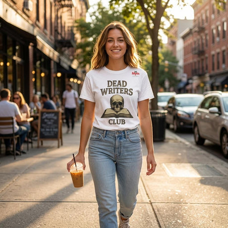 Woman walking on a city street wearing a 'Dead Writers Club' t-shirt.