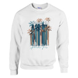 White sweatshirt with palm tree design and 'Paradise Found' text on a white background