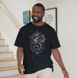 Man wearing a black t-shirt with a dragon design indoors.
